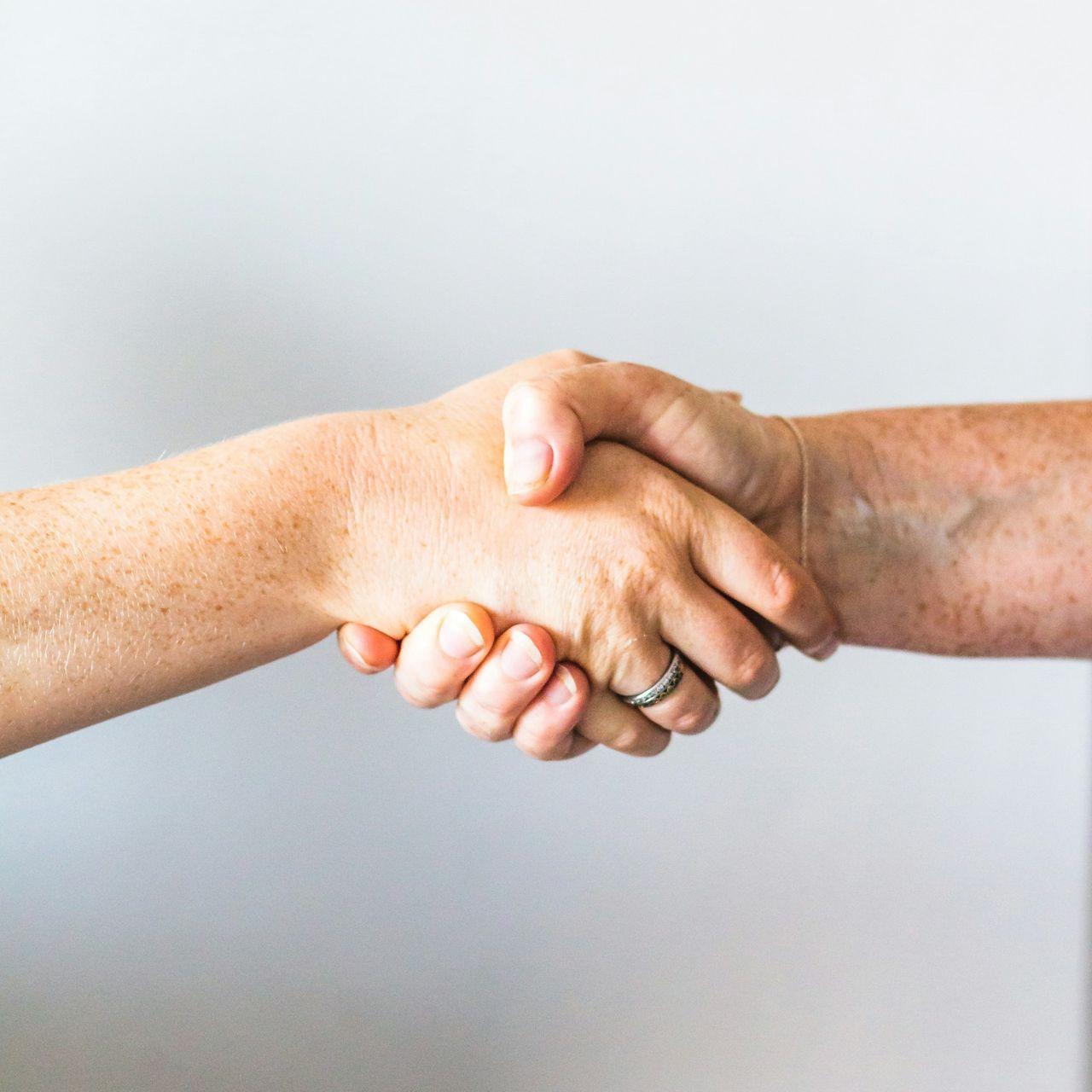 person holding hands of another person